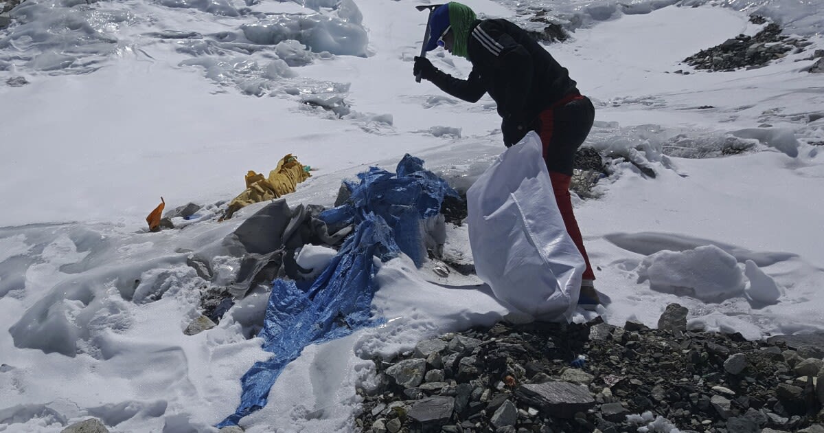 Everest's highest camp is littered with frozen garbage. The cleanup will take years