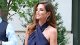 Cindy Crawford looks effortlessly chic in a halterneck navy dress