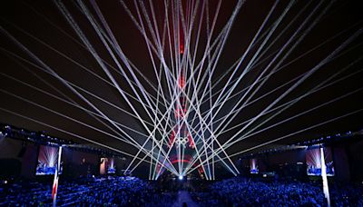 Olympics day one: Spotlight on sport after rain dampens unique opening ceremony
