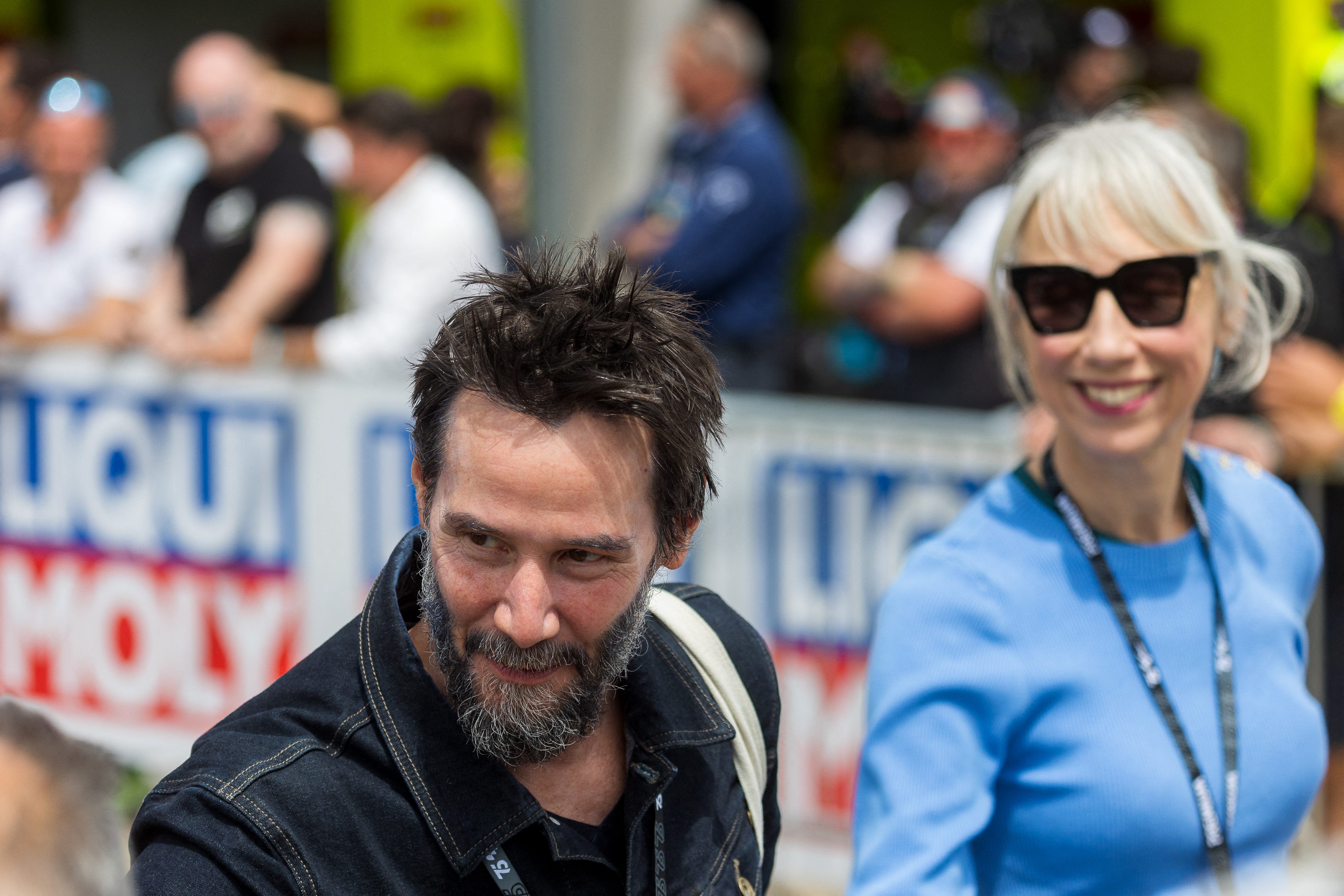 Keanu Reeves, girlfriend Alexandra Grant hop on motorbike at Grand Prix in Germany