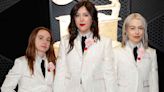 Boygenius Wears Matching White Suits and Pink Carnation Boutonnieres for 2024 Grammys Debut