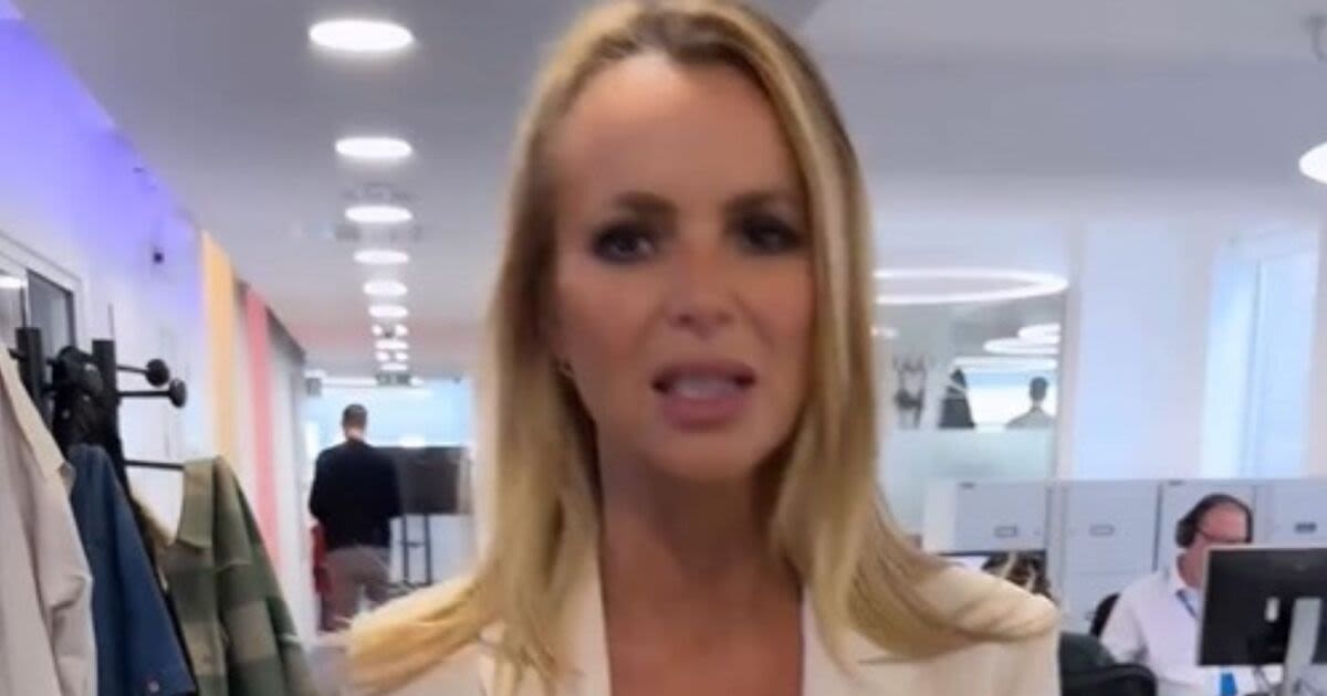 Amanda Holden says plunging dress is 'little revealing' as she divides fans