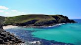 The hidden UK beach with crystal clear waters and a stunning rock archway