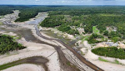 In pictures: River level at Amazon rainforest port hits 122-year low amid drought