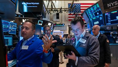 Dow soars to fresh record while gold prices hit all-time high