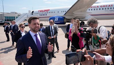 On the plane with JD Vance, Trump's attack dog