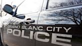 Grand Blanc woman who was hit while walking her dog dies