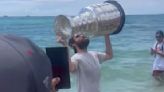 Panthers' Matthew Tkachuk takes a dip in the ocean with Stanley Cup