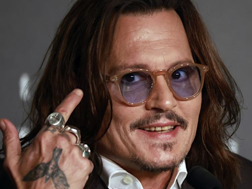 Johnny Depp parties in the Caribbean, but no longer has teeth of a pirate