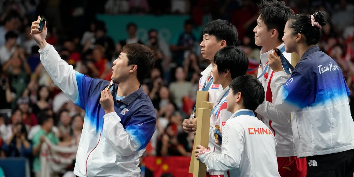 North and South Korea celebrate with selfies during the medal ceremony at the Paris Olympics