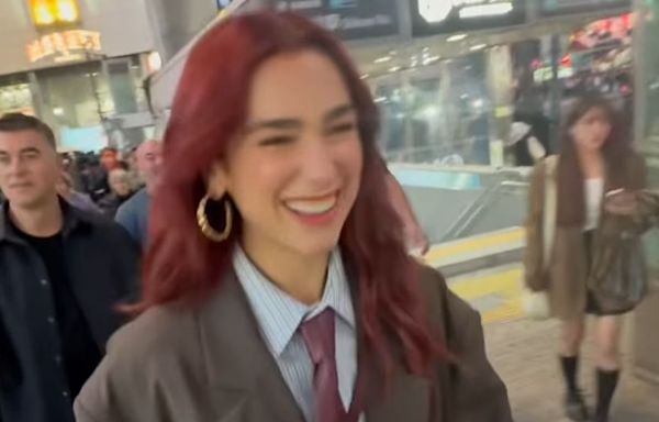 Dua Lipa Makes the Pantsless Trend Look Preppy in an Oversize Blazer and Blood-Red Tie