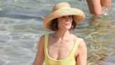 Gemma Arterton, 38, hits the beach in a canary yellow swimsuit