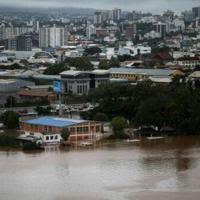 On Friday, it was the turn of state capital Porto Alegre, home to some 1.5 million people, to have its roads inundated by the rising waters of the Guiaba river