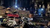 Fierce storm topples tree at Cambodian Angkor temple complex, killing 1 and damaging statues