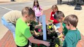 Downtown in bloom with pollinator-friendly flowers planted by St. Edward second graders