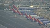 Rows of Southwest planes parked in California as thousands of flights cancelled