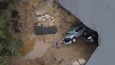 Sinkholes swallow cars as torrential rain batters California - and another powerful storm is coming