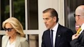 Hunter Biden, joined by his mother US First Lady Jill Biden, exits the J. Caleb Boggs Federal Building in Wilmington, Delaware, on June...