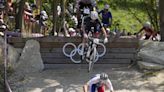 Britain’s Tom Pidcock makes winning pass on final lap to defend his Olympic mountain bike title