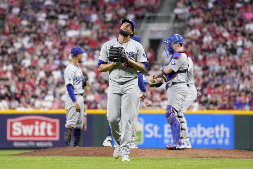 Dodgers' injury-ravaged bullpen finally implodes in loss to Reds