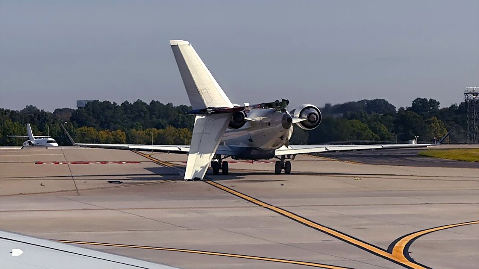 Delta flight clips another plane on taxiway at Atlanta airport, knocks off smaller plane's tail