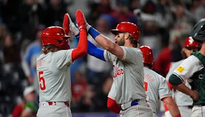 Bryce Harper hits a 3-run homer in Phillies' 9th-inning rally to beat Rockies 8-4