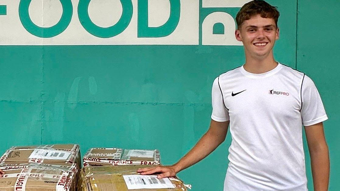TV show winner delivers football kits to children