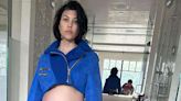 Pregnant Kourtney Kardashian Jokes She's 'Hanging on by a Thread' While Showcasing Baby Bump in Blue Outfit