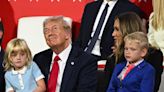 Trump's grandkid Carolina, 4, sits on his lap to watch dad Eric speak