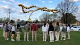 North Platte Catholic Schools celebrates seniors last day with balloon rosary release