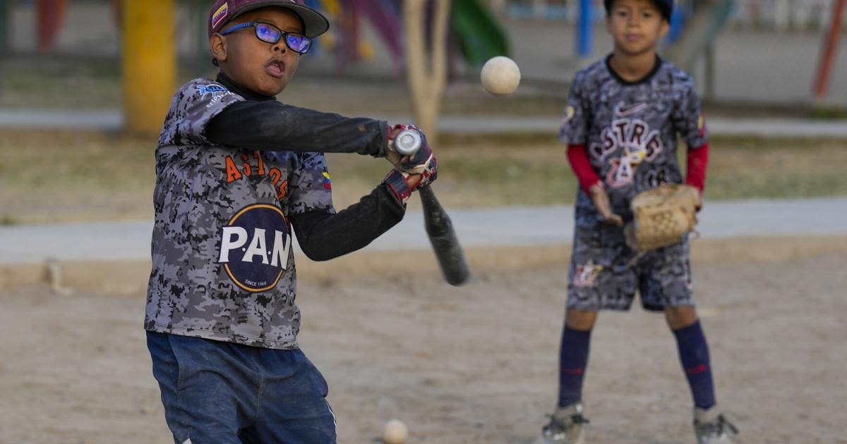 Baseball a shelter for Venezuelan kids in soccer-mad Peru