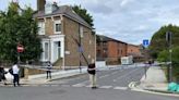 Police 'tear down' street in double murder probe