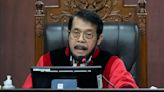 Court panel removes Indonesia's chief justice for ethical breach that benefited president's son