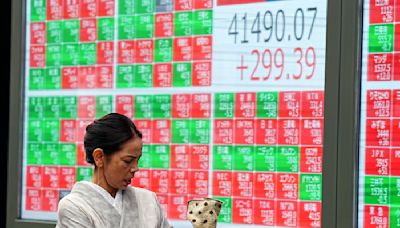 Stock market today: Asian stocks are mixed after Dow sets a new record