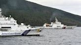 Chinese armed vessels patrol waters around disputed islands, angering Japan