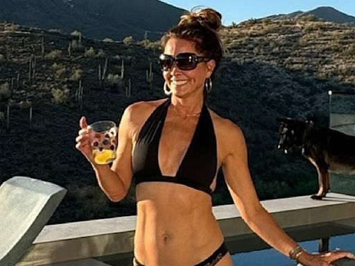 Brooke Burke, 52, poses in a tiny bikini