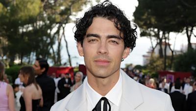 Joe Jonas’ amfAR Cannes Gala Look Draws Comparisons to Colonel Sanders, He Responds