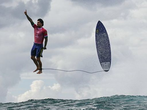 The photo that takes Olympic gold - stunning shot of Brazilian surfer Gabriel Medina in Tahiti goes viral