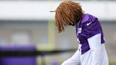 Vikings Lewis Cine leaves field on cart with air cast