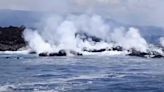 Lava flow from volcano on an uninhabited Galapagos island reaches ocean