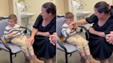 Boy with cochlear implants shares sweet smile after hearing parents for 1st time