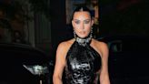 Kim Kardashian Wears Skintight Black Vinyl Dress to Dinner In NYC