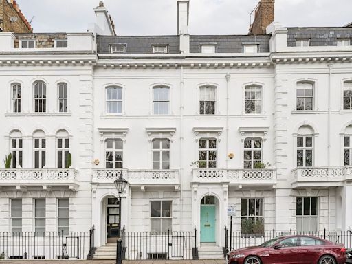 Stucco-fronted townhouse available to rent with views of J.M. Barrie's home