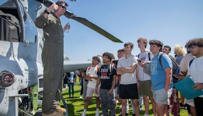 Marines land in Walt Whitman's field, take students by storm and music