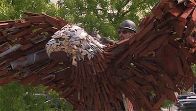 Metal eagle sculpture honoring military installed in Happy Valley