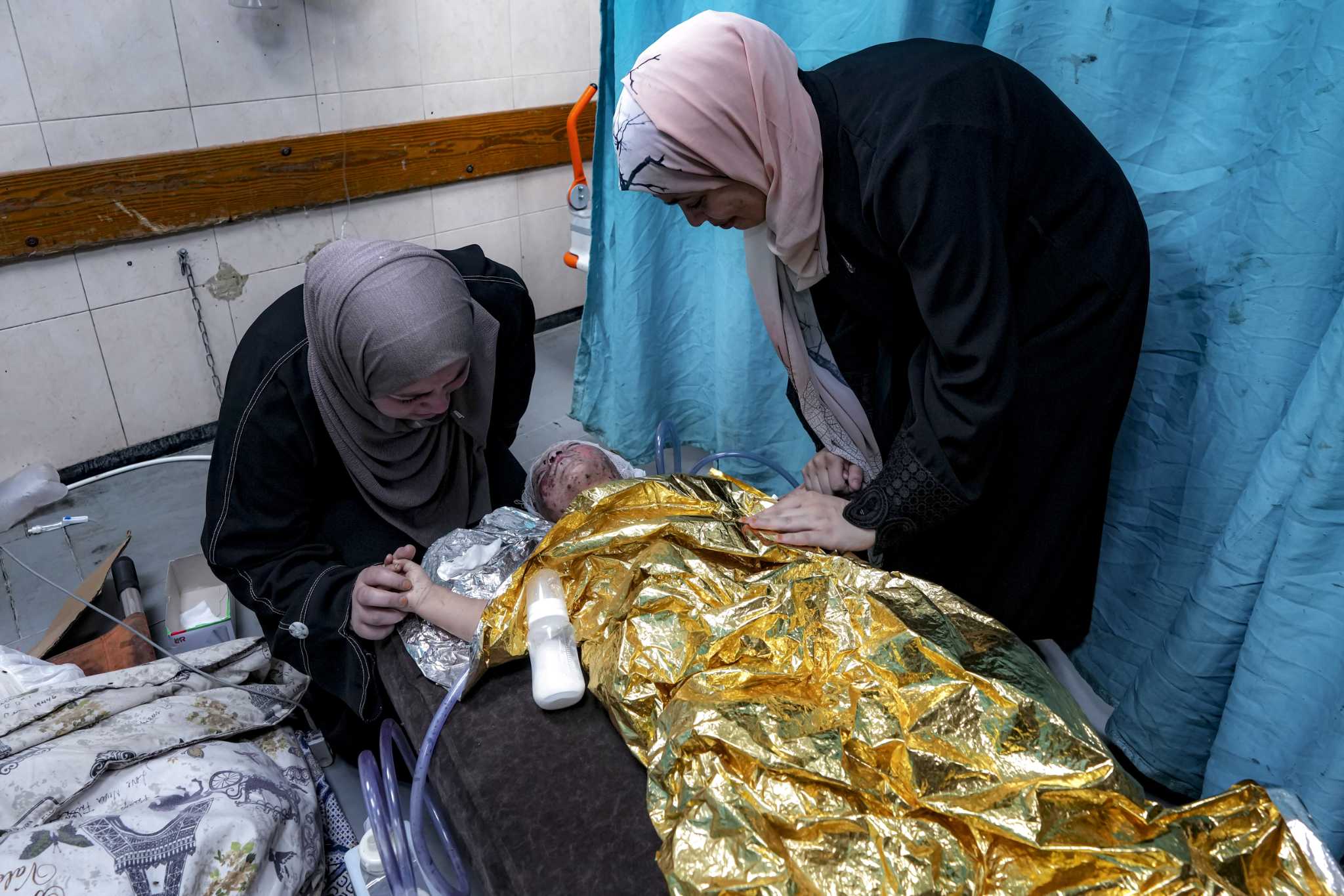 Wounded in a strike that killed her family, a 2-year-old joins Gaza's ranks of thousands of orphans