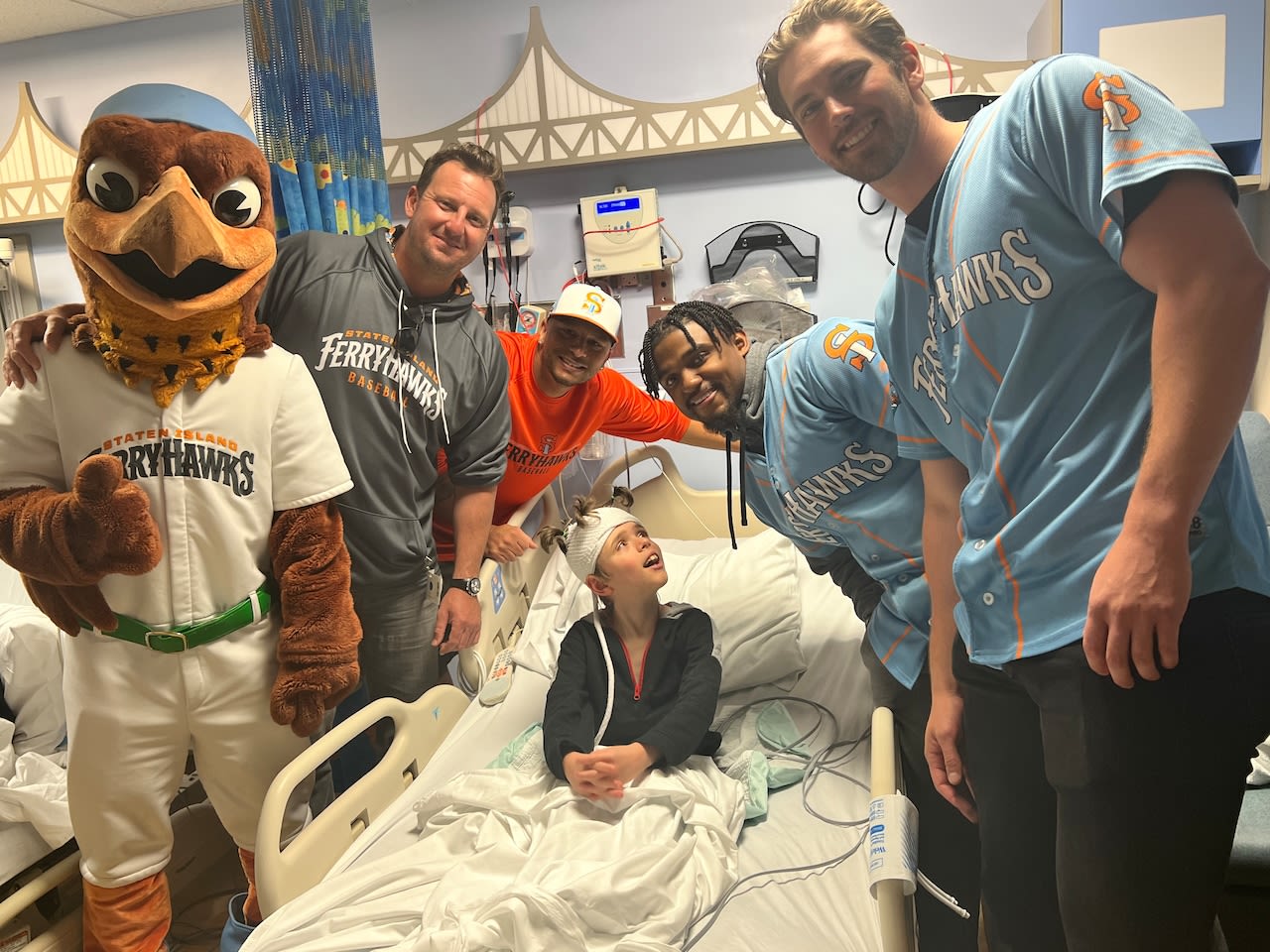 Staten Island FerryHawks spread cheer with surprise visit to young hospital patients