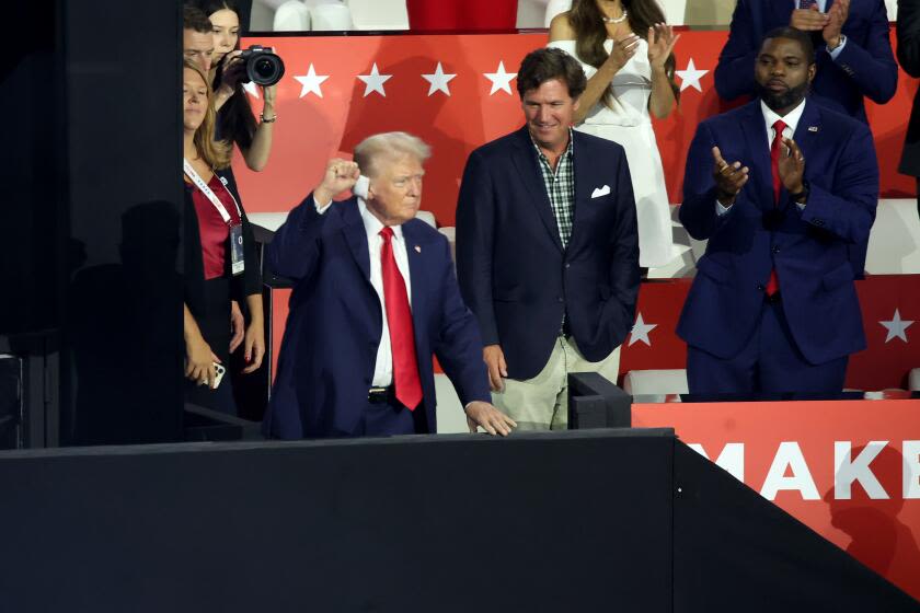 Trump, with bandaged ear, excites GOP convention in first post-shooting appearance