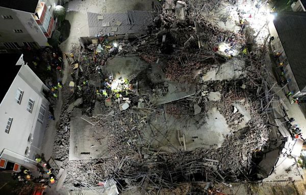 Building collapse in South Africa leaves three dead, dozens trapped