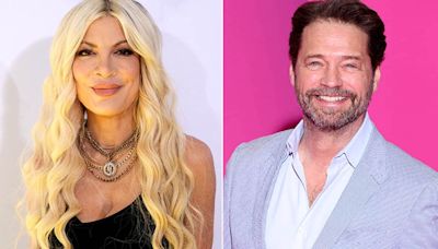 Tori Spelling says she chipped her front tooth during makeout session with Jason Priestley in an elevator